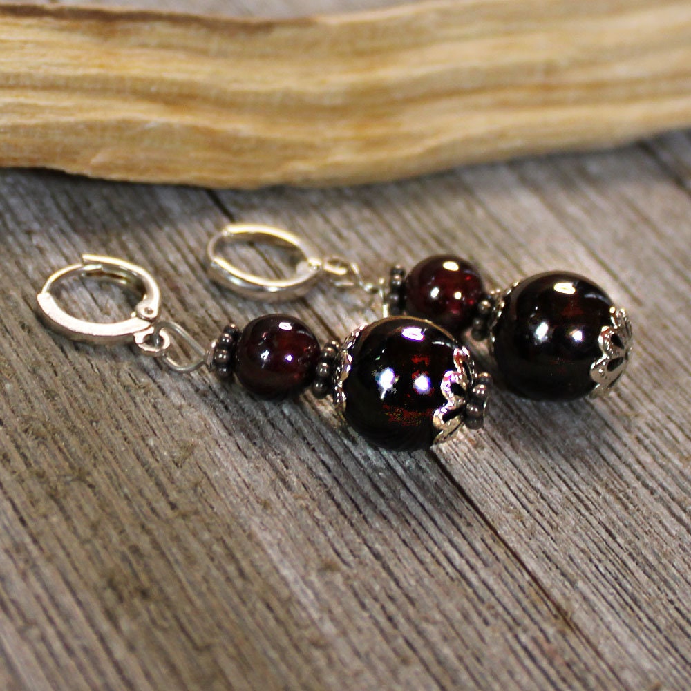 Sacred Geometry Garnet Earrings featuring artisan handmade design with sterling silver lever back earwires.
