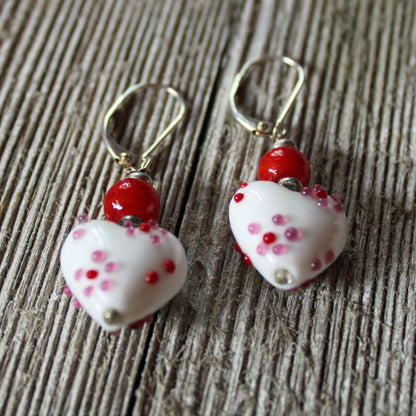 Heart Earrings - Tell her she has your heart, showcasing beautiful lampwork glass in pink and red colors. These dangle earrings are a romantic accessory, perfect for expressing your love.