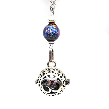 Woman wearing the Namaste Symbol Color Changing Essential Oil Diffusing Zen Chamber Necklace, illustrating its stylish look for yoga and meditation.