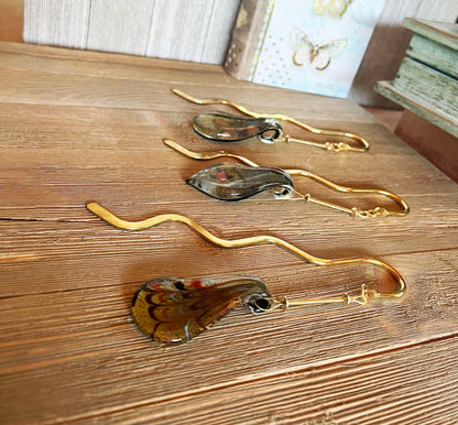 Elegant Art Glass and Carnelian Oval Hook Bookmark displayed on an open book, ideal as a reader gift with a minimalist vibe.