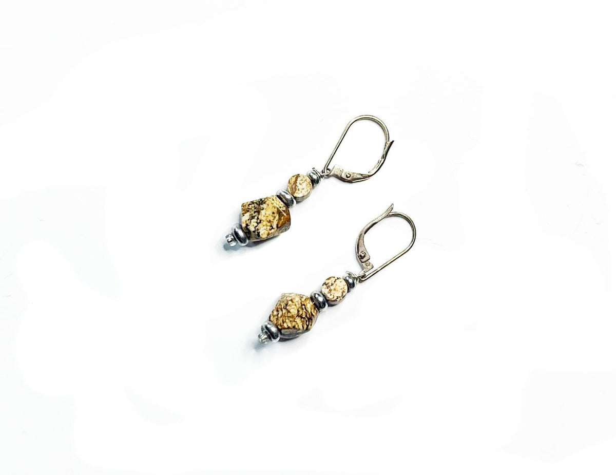 The Handcrafted Jasper Earrings feature sterling silver lever-back clasps and textured gold and silver beads for a geometric Zen look, beautifully presented on a white background.