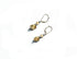 The Handcrafted Jasper Earrings feature sterling silver lever-back clasps and textured gold and silver beads for a geometric Zen look, beautifully presented on a white background.