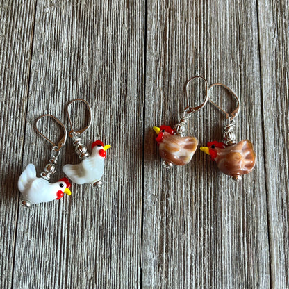 Close up of hand-crafted chicken earrings that are egg stra ordinary - perfect farm themed jewelry for chicken lovers.