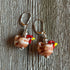Brown lampwork glass chicken earrings, a unique and egg stra ordinary gift for chicken lovers, inspired by farm aesthetics. Perfect for showcasing your love for hens.