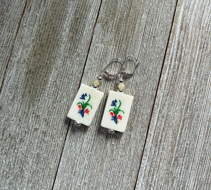 Mahjong Tile Earrings with a focus on wind tile motifs, including north and south directions, part of the game&
