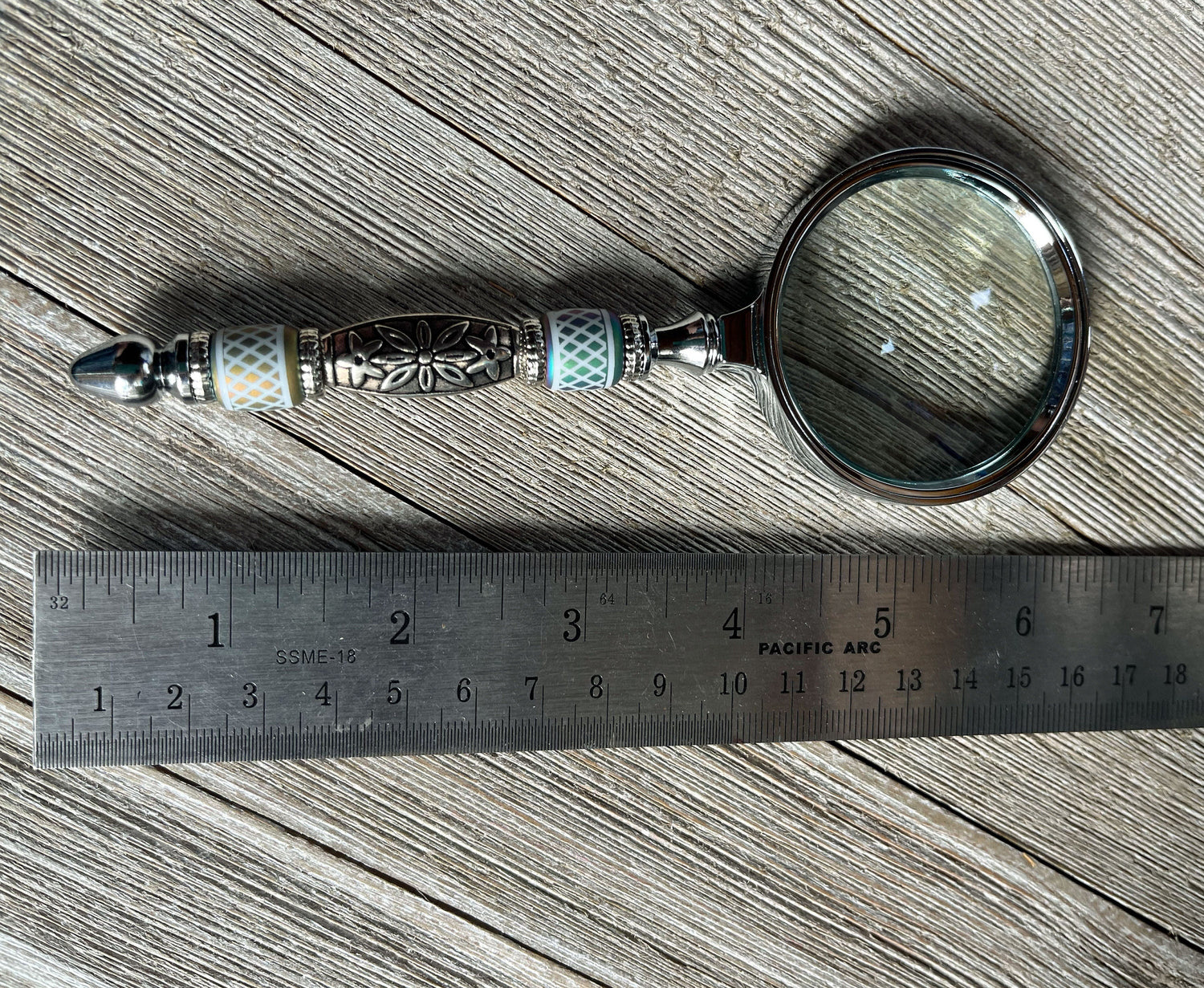 Handheld Eye Catching Gift - Shimmering Bead Handed Magnifier showing the durable silver metal handle, great for detailed work or reading.