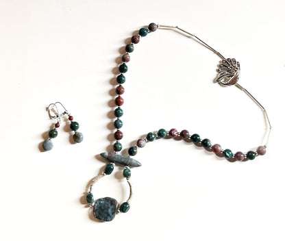Close-up view of Fancy Peacock Jewelry Set highlighting the soft pastel Fancy Jasper stones and detailed sterling silver peacock clasp.