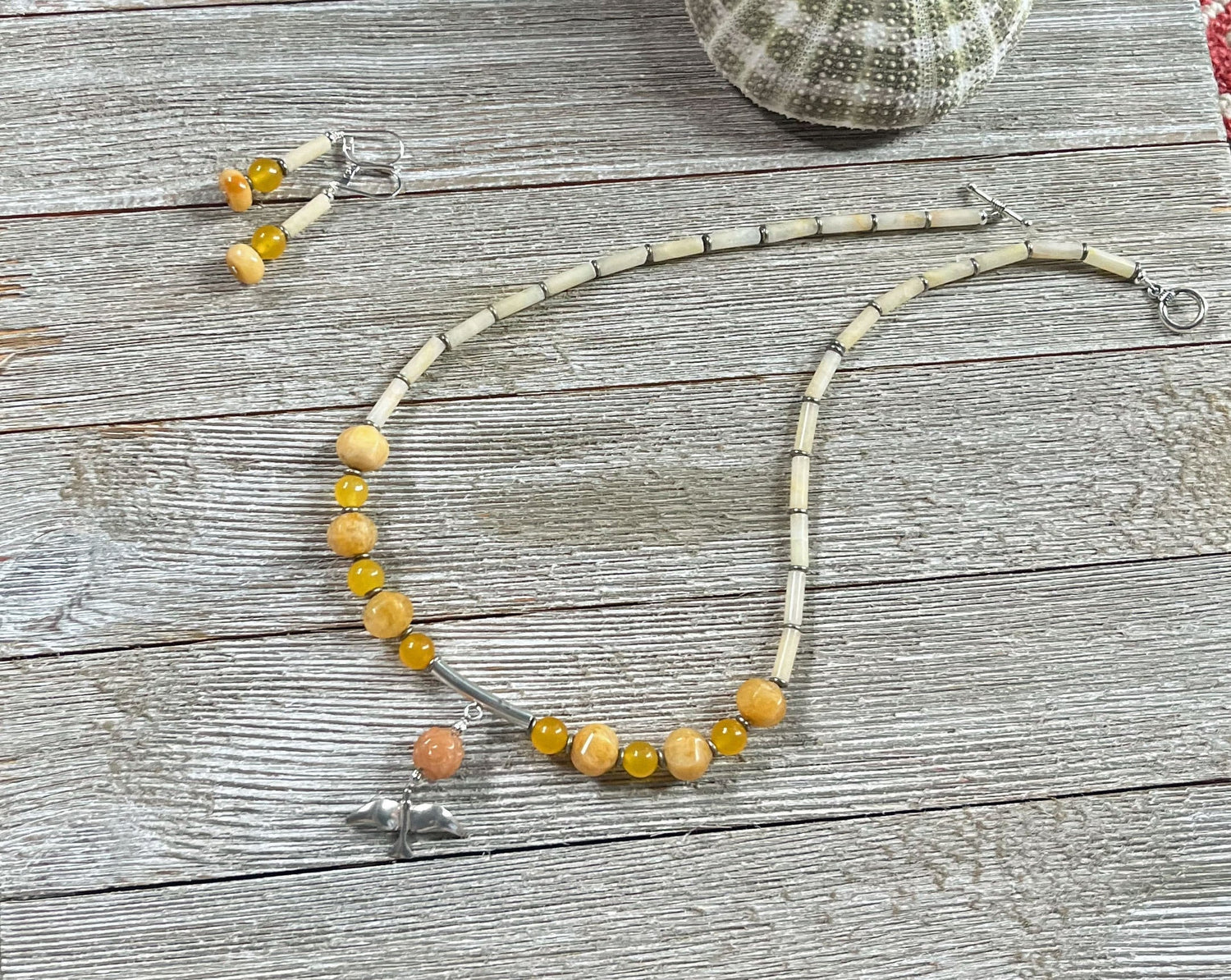Silver Bird in Flight Necklace featuring sunset colored stones including orange and yellow aventurine and quartz, artisan designed gift.