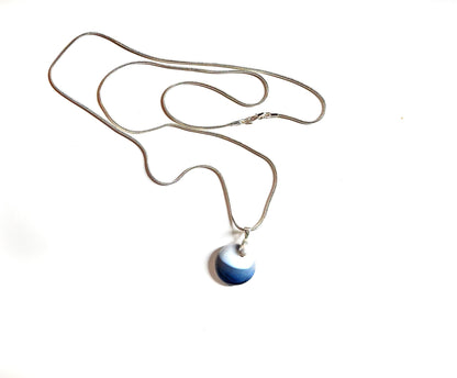 Close-up of Blue Agate Pendant Minimalist Necklace - Simple Gift for a Friend, showcasing the handcrafted design and unique concentric circle pattern.