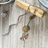 Metal Bookmark Gift - Unakite Flower and Ginko Leaf Zen Aesthetic Bookmark displayed elegantly with a pink khaki theme, perfect for book lovers.