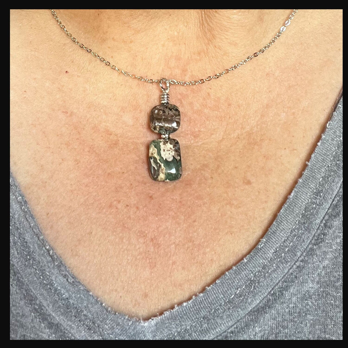 Close-up of the Rainforest Rhyolite Necklace from the Rainforest Rhyolite Jewelry Set, showcasing its intricate stone patterns and sterling silver chain.