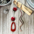 Art Glass and Carnelian Oval Hook Bookmark showcasing its elegant design, a perfect page holder for book lovers.