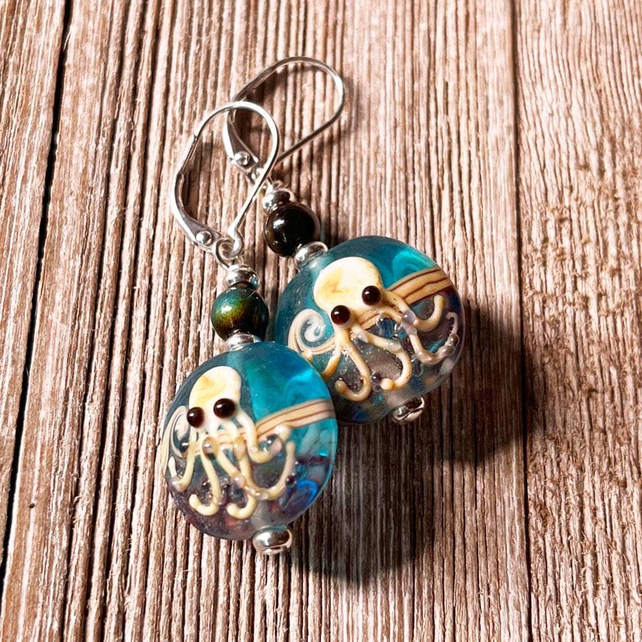 Close-up of Octopus Earrings showcasing intricate lamp-worked glass craftsmanship and playful octopus design, a unique piece of cephalopod jewelry.