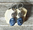 Sodalite earrings - artisan-designed stone and spiral, denim blue earrings. Close-up view highlighting intricate blue swirls and sterling silver accents.