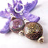 Magic Mood Change mandala earrings showcase a transforming floral design with color changing beads that reflect shades of purple, yellow, and green, perfect for boho style jewelry.