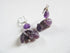 Handcrafted Amethyst Hippo Earrings with Sterling Silver lever backs, featuring carved purple hippos and round amethyst beads—ideal for lovers of unique handmade jewelry and displayed on a white background.