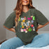 May include: A green t-shirt with the words &