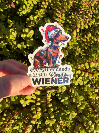 Everyone Needs a Little Christmas Wiener – Dachshund Holiday Sticker (2” or 3”) — Clear or Holographic