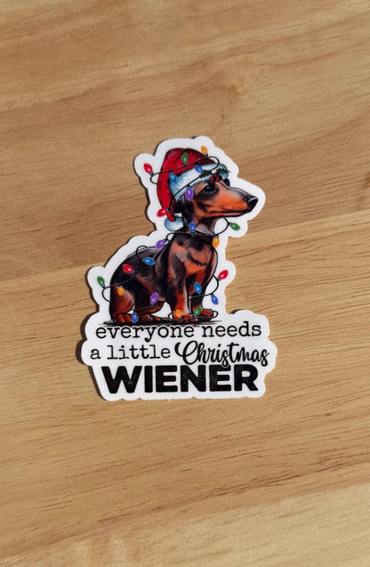 Everyone Needs a Little Christmas Wiener – Dachshund Holiday Sticker (2” or 3”) — Clear or Holographic
