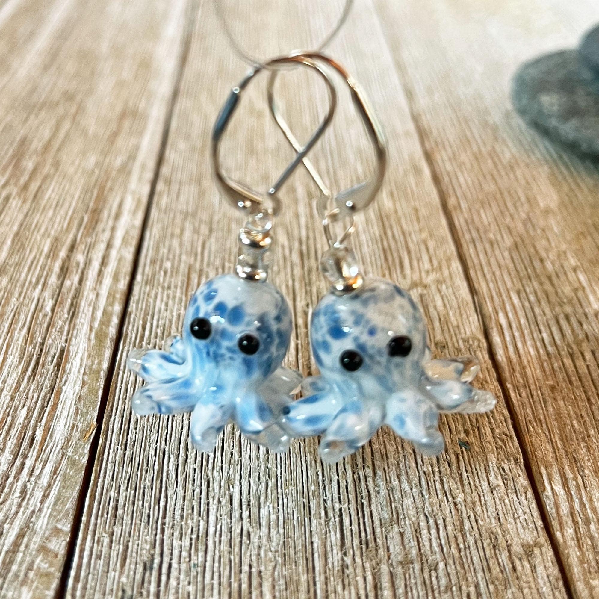 Add a nautical touch with Handcrafted Glass Octopus Earrings: Ocean Blue Animal Jewelry, featuring blue glass octopus charms with black eyes—perfect for ocean-inspired style.