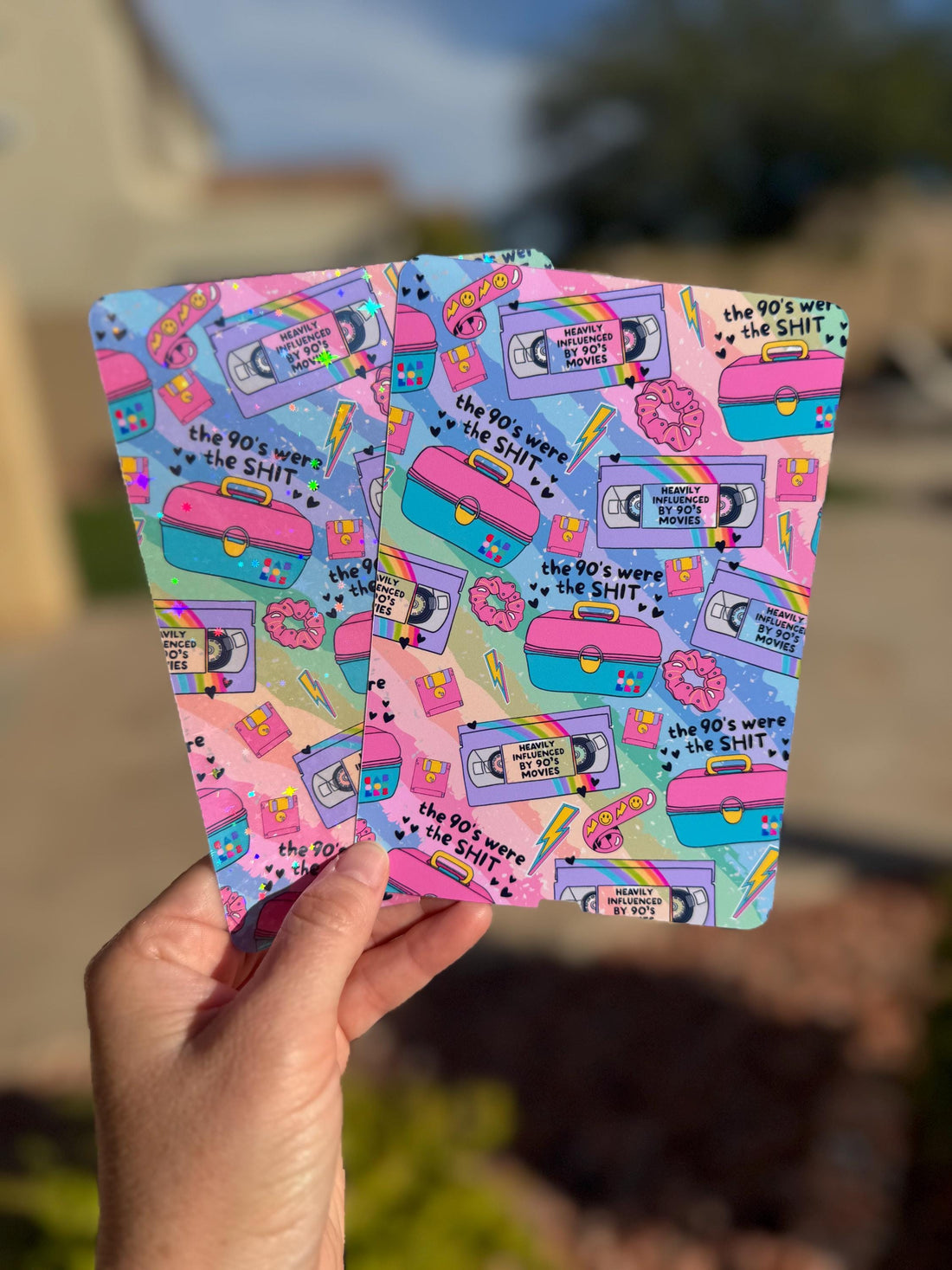 May include: Two colorful cards with a repeating pattern of 90s-themed icons, including a cassette tape, a boombox, and a scrunchie. The text &amp;quot;the 90&amp;