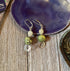 Handmade Citrine African Turquoise Earrings: Spring Swirl Silver Jewelry—featuring citrine, turquoise stones, and silver swirl charms—bring an elegant accent to your collection. Displayed on a purple dish over wood for a stylish touch.