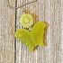 The Carved Jadeite Butterfly Pendant with Flower – Spring Nature Jewelry features a green butterfly pendant on a silver chain, beautifully showcased on textured wood.