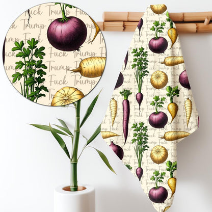 Towel with repeating pattern of vegetables and &amp;quot;Trump&amp;quot; text.
