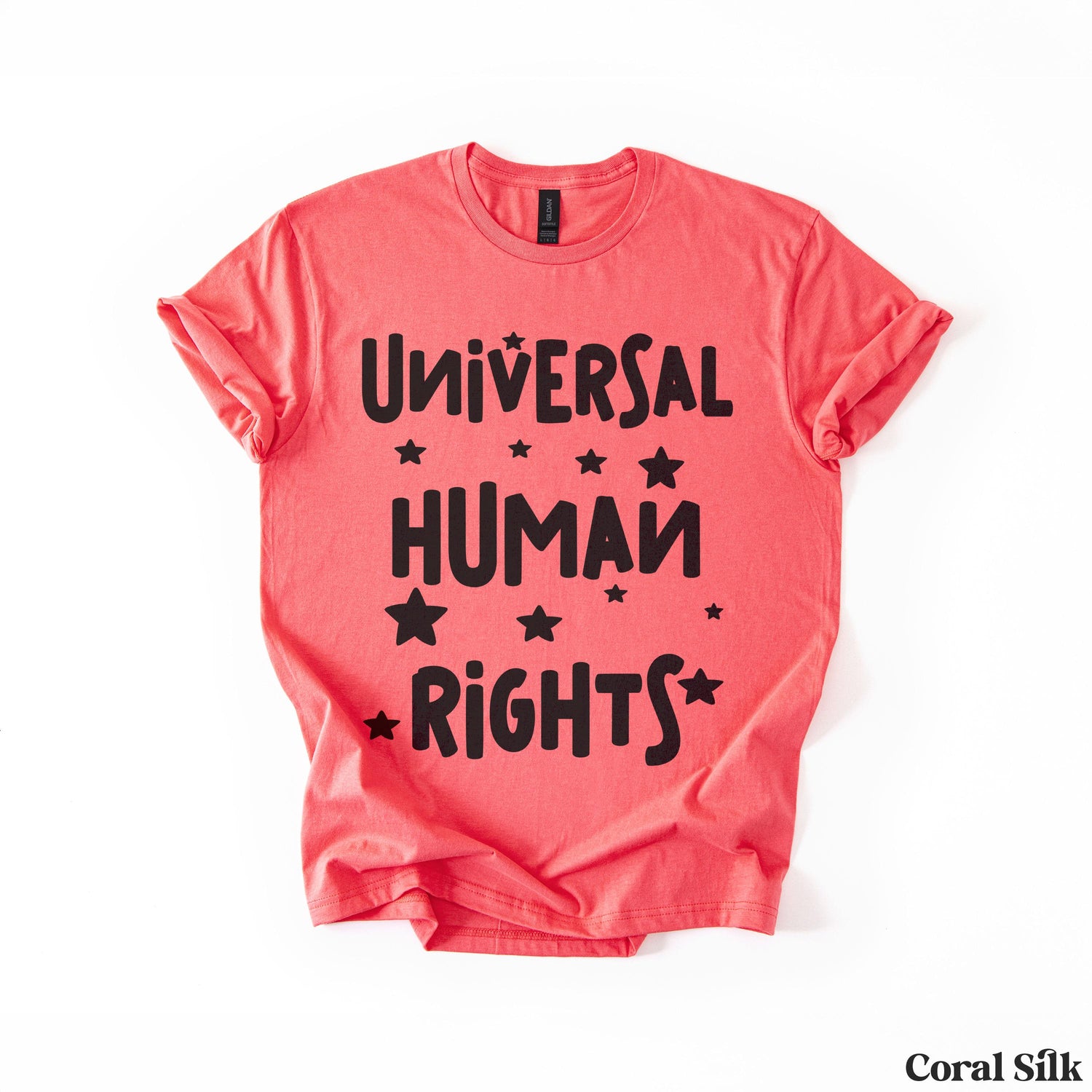 Coral t-shirt with &amp;quot;Universal Human Rights&amp;quot; and stars.