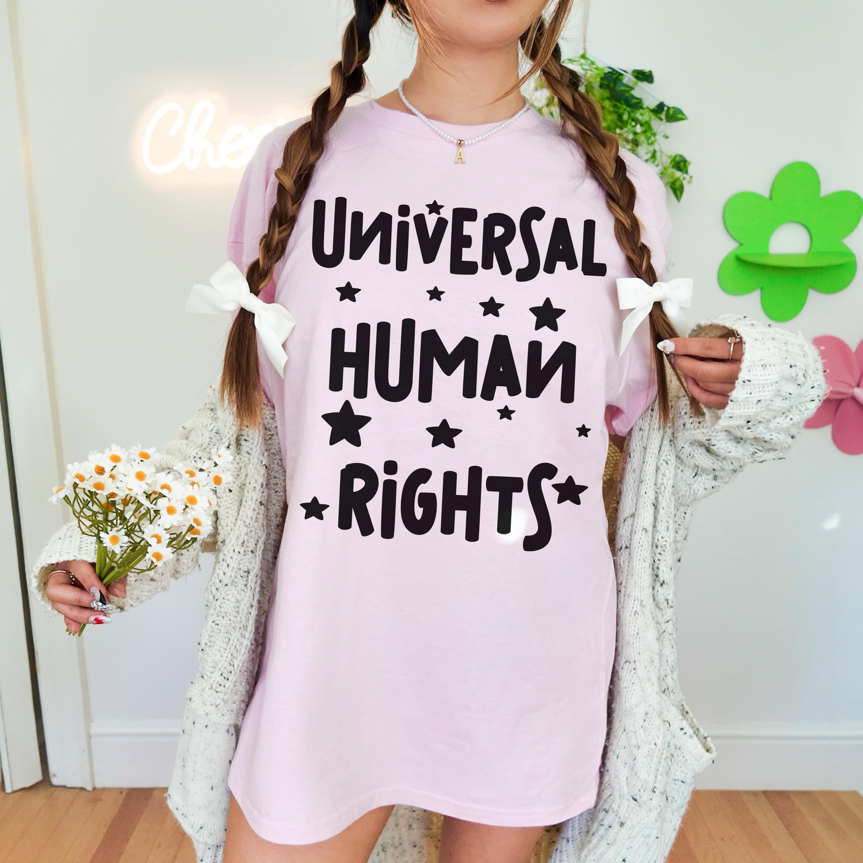 Pink t-shirt with &amp;quot;Universal Human Rights&amp;quot; text and small white stars.