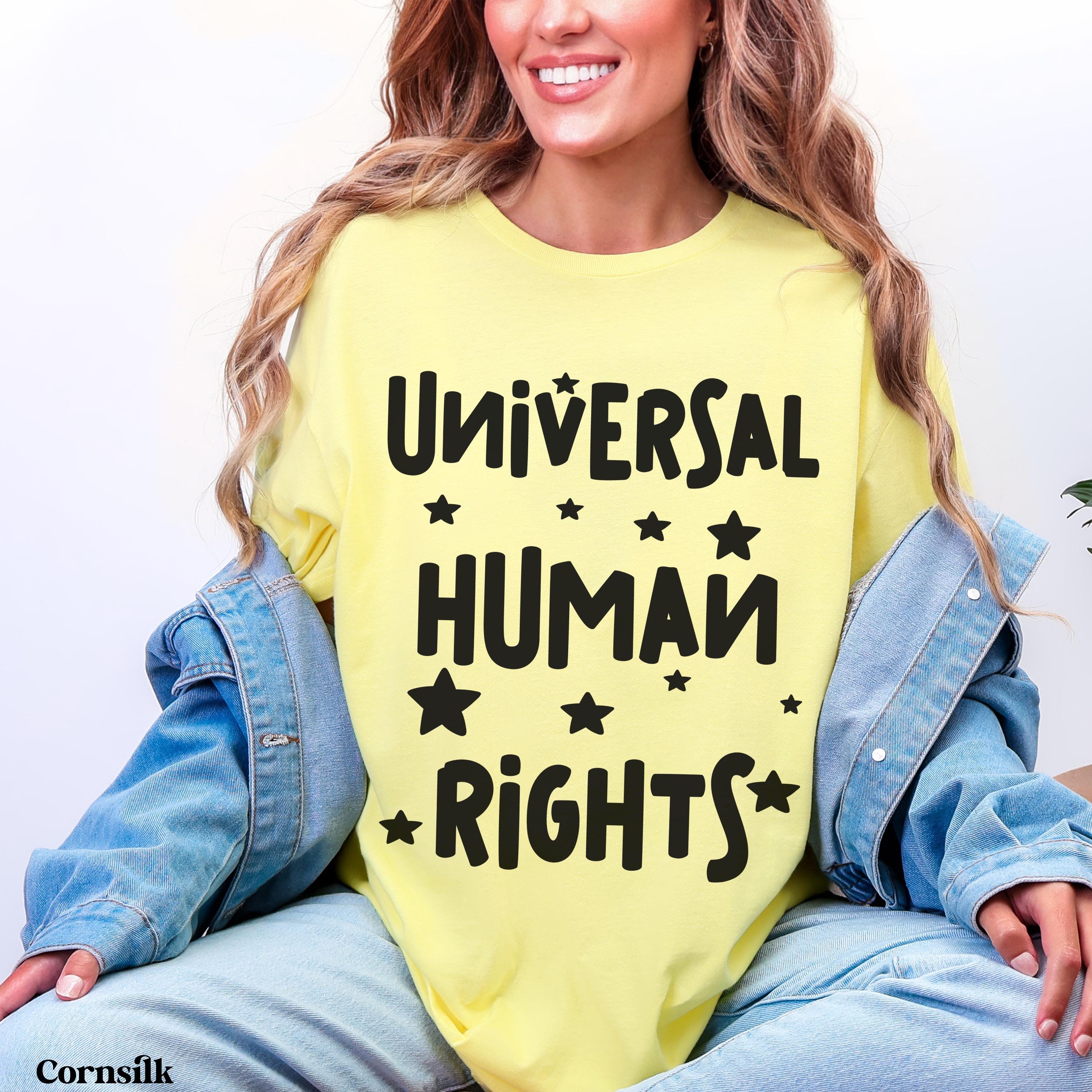 Yellow t-shirt with &amp;quot;Universal Human Rights&amp;quot; and stars printed in black.