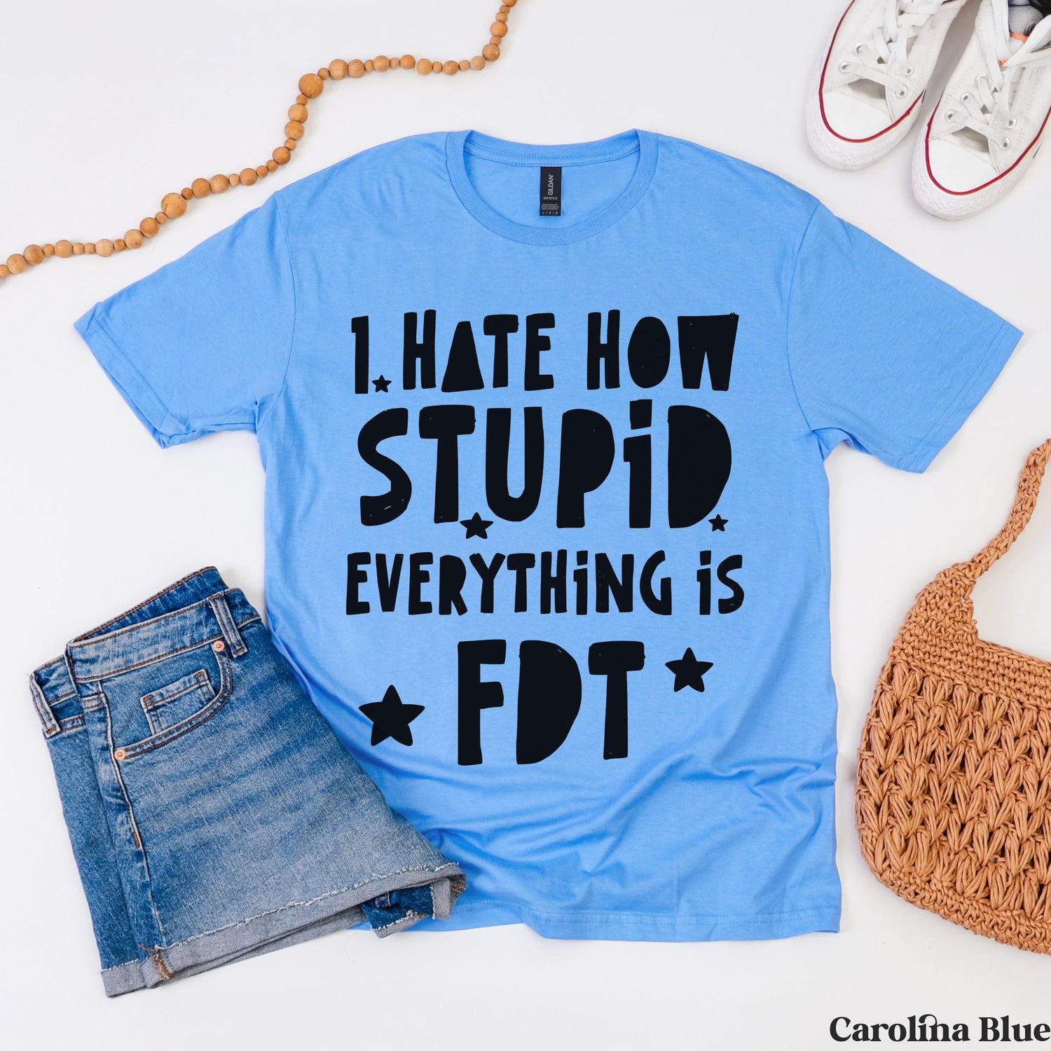 Carolina blue t-shirt with &amp;quot;I hate how stupid everything is&amp;quot; text in black.