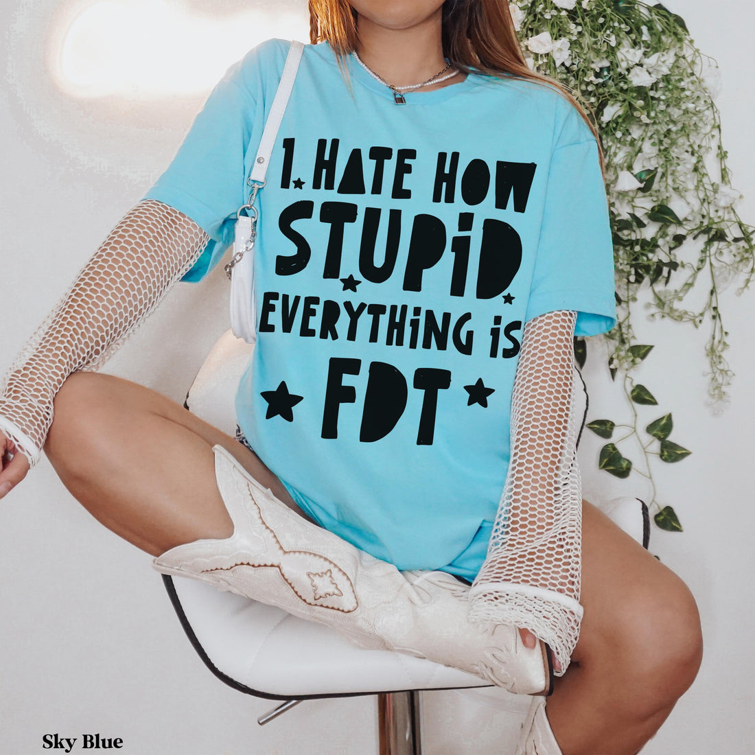 Light blue t-shirt with black text: &amp;quot;I HATE HOW STUPID EVERYTHING IS FDT&amp;quot;.