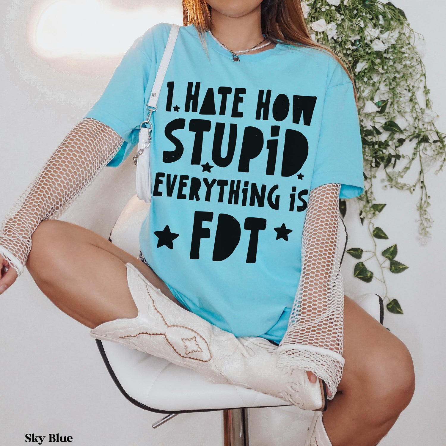 Light blue t-shirt with black text: &amp;quot;I HATE HOW STUPID EVERYTHING IS FDT&amp;quot;.