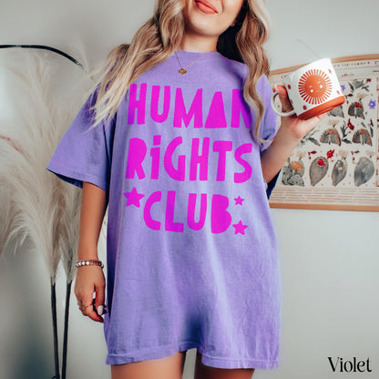 Purple t-shirt with &amp;quot;Human Rights Club&amp;quot; and stars in bright pink lettering.