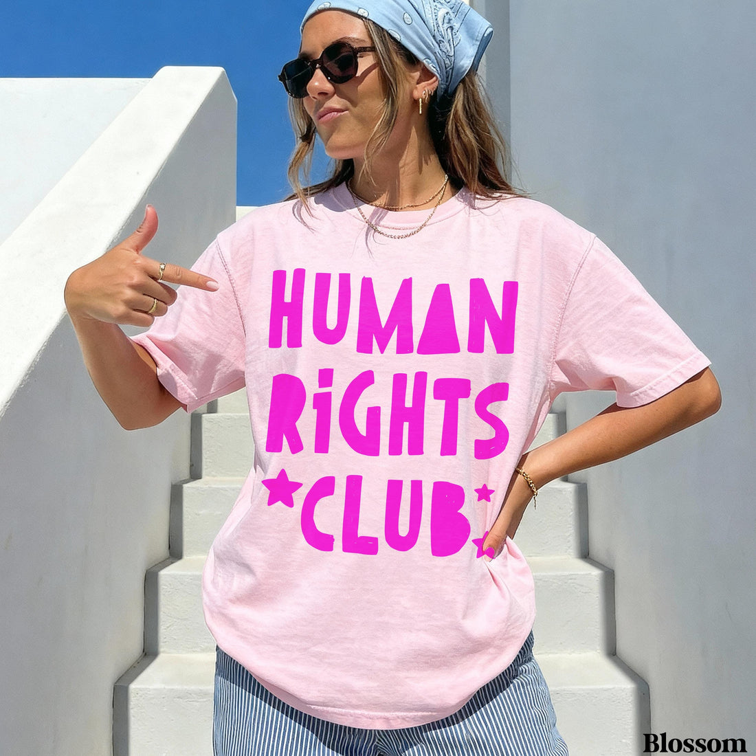 Woman wearing pink t-shirt with &amp;quot;HUMAN RIGHTS CLUB&amp;quot; text and star accents.