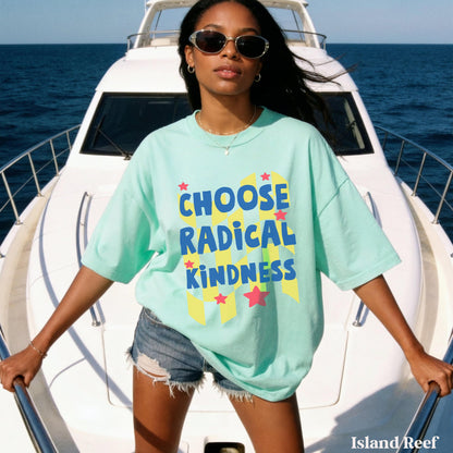 Woman in mint t-shirt with &amp;quot;CHOOSE RADICAL KINDNESS&amp;quot; text stands on a boat.