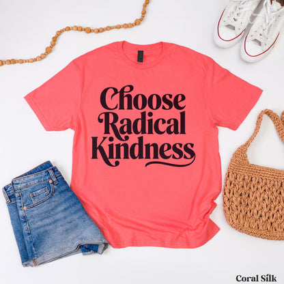 Coral silk t-shirt with &amp;quot;Choose Radical Kindness&amp;quot; text, styled with jeans and a straw bag.
