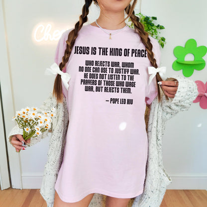 Pink t-shirt with quote from Pope Leo XIII about peace.