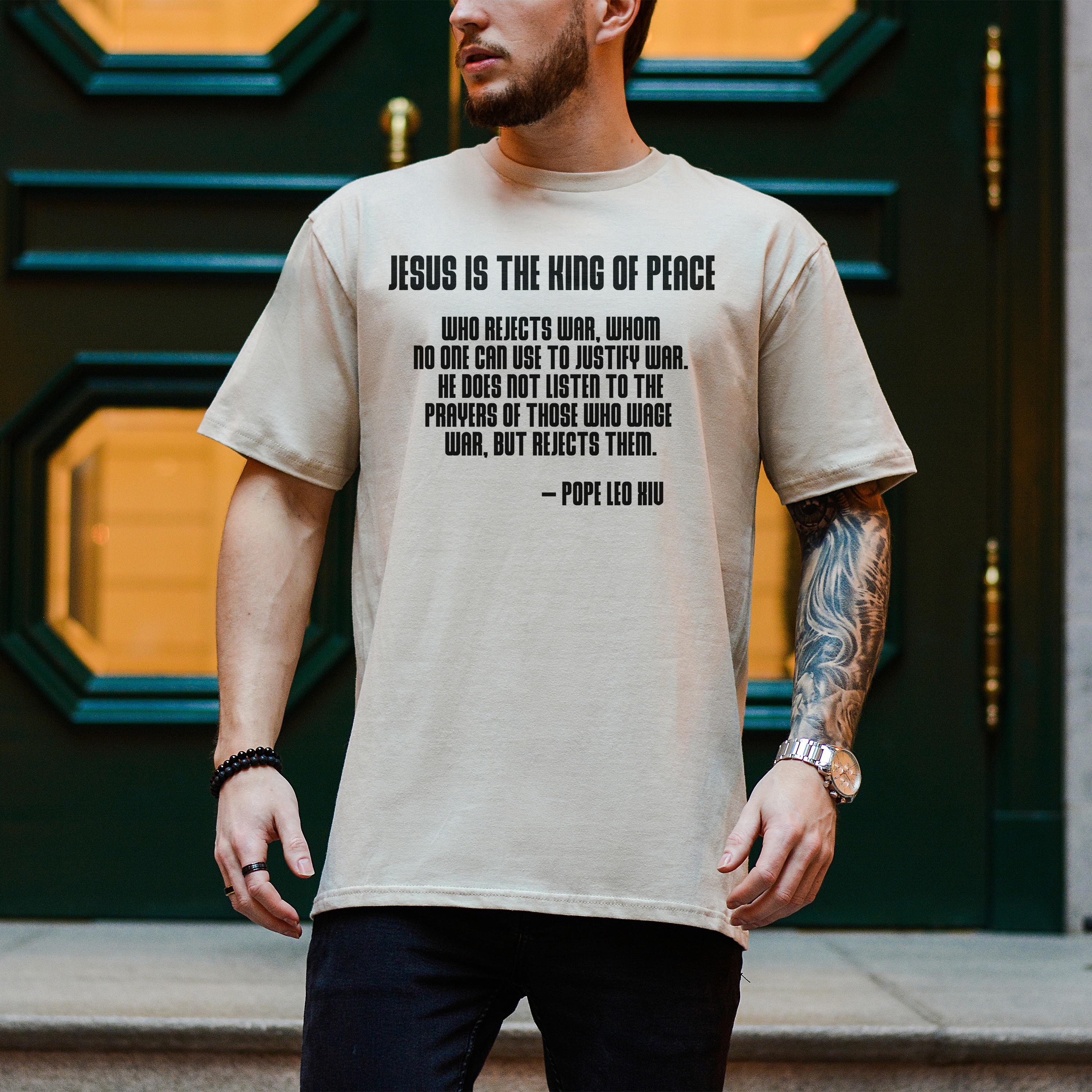 Beige t-shirt with Pope Leo XIII quote about Jesus being the King of Peace.