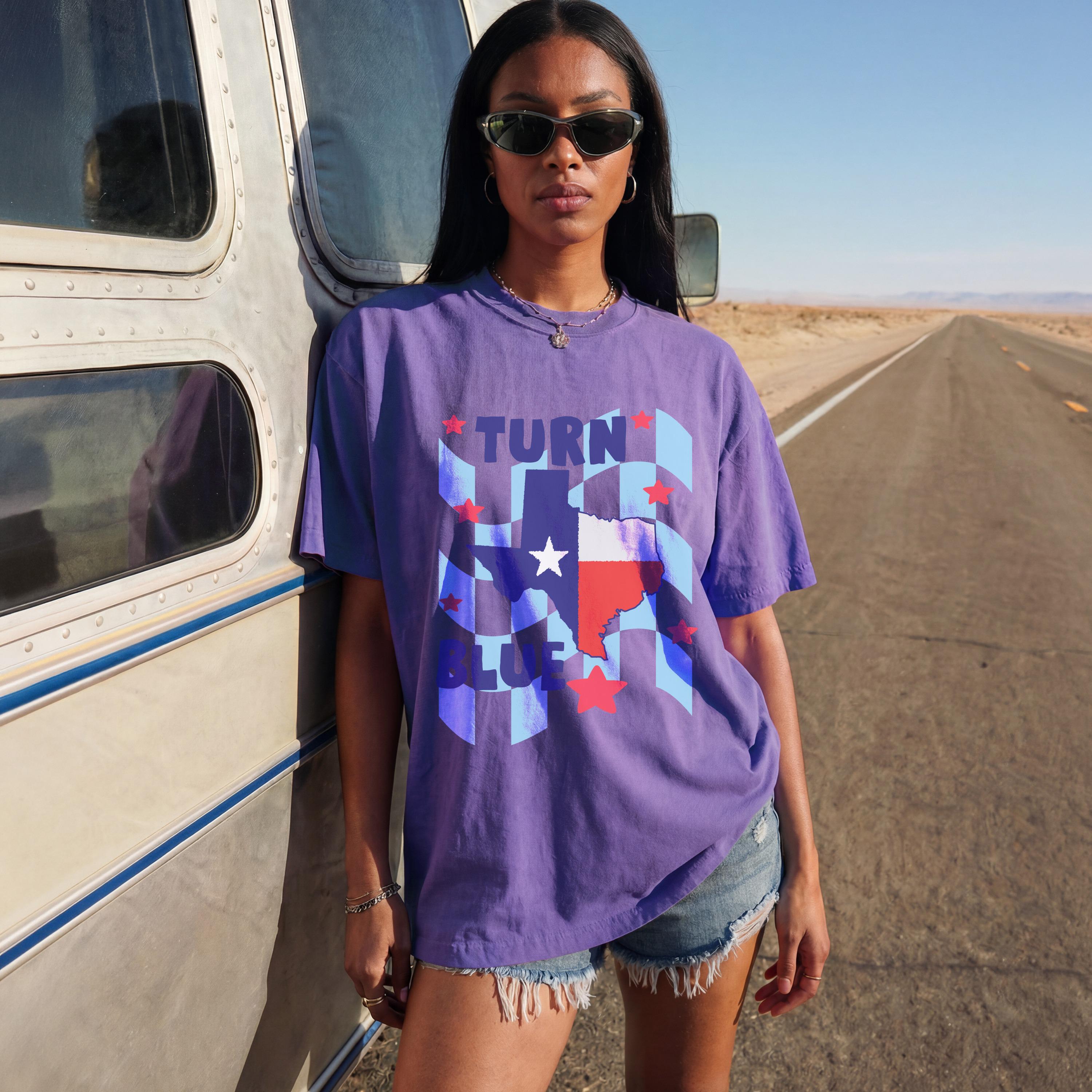 Woman wearing a purple t-shirt with Texas map design and text &amp;quot;TURN&amp;quot;.