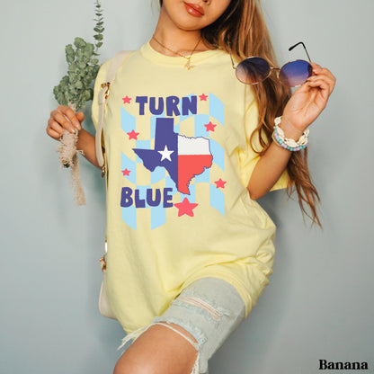 Yellow t-shirt with Texas flag and &amp;quot;TURN BLUE&amp;quot; text, featuring star accents.