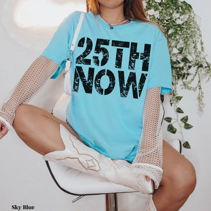 Light blue t-shirt with &amp;quot;25TH NOW&amp;quot; in black text.