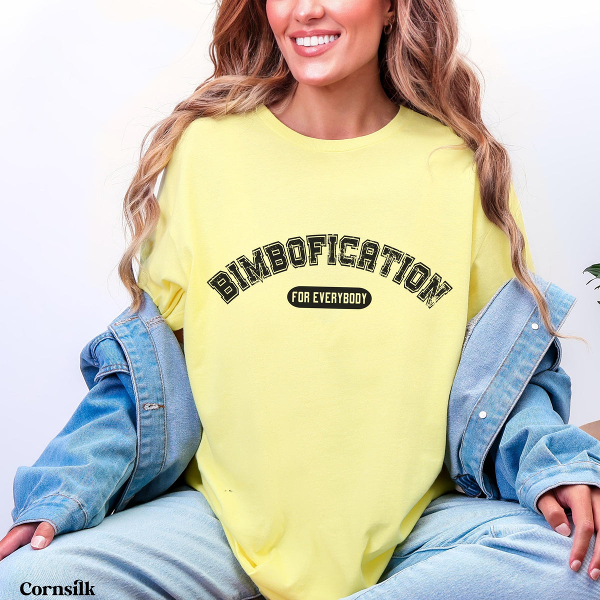 Yellow t-shirt with &amp;quot;BIMBOFICATION FOR EVERYBODY&amp;quot; text.