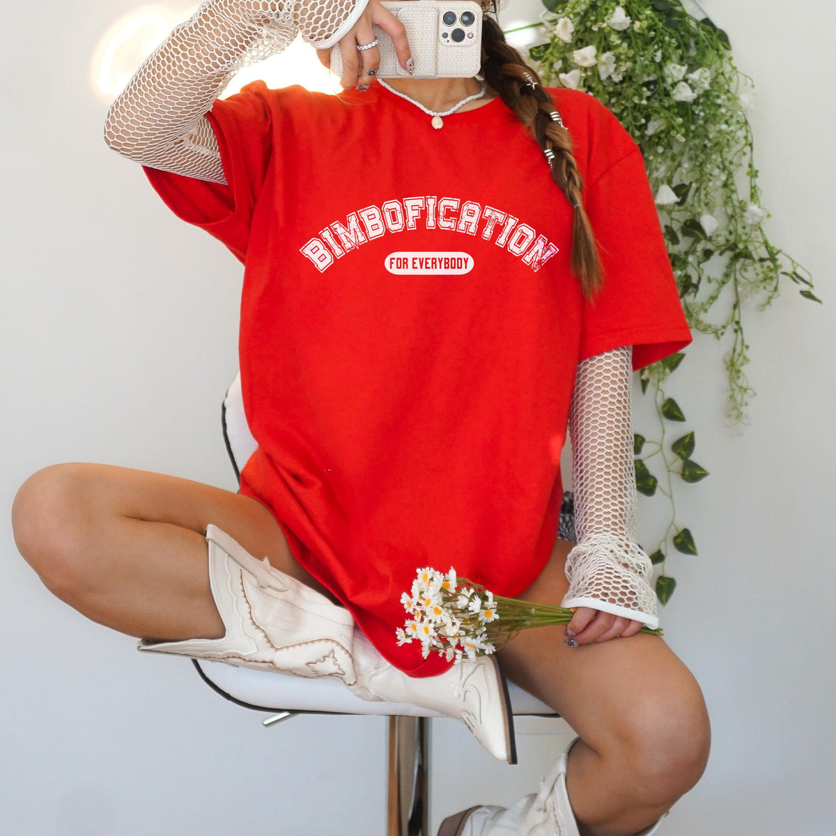 Red t-shirt with &amp;quot;BIMBOFICATION FOR EVERYBODY&amp;quot; text, worn by a person in white boots.