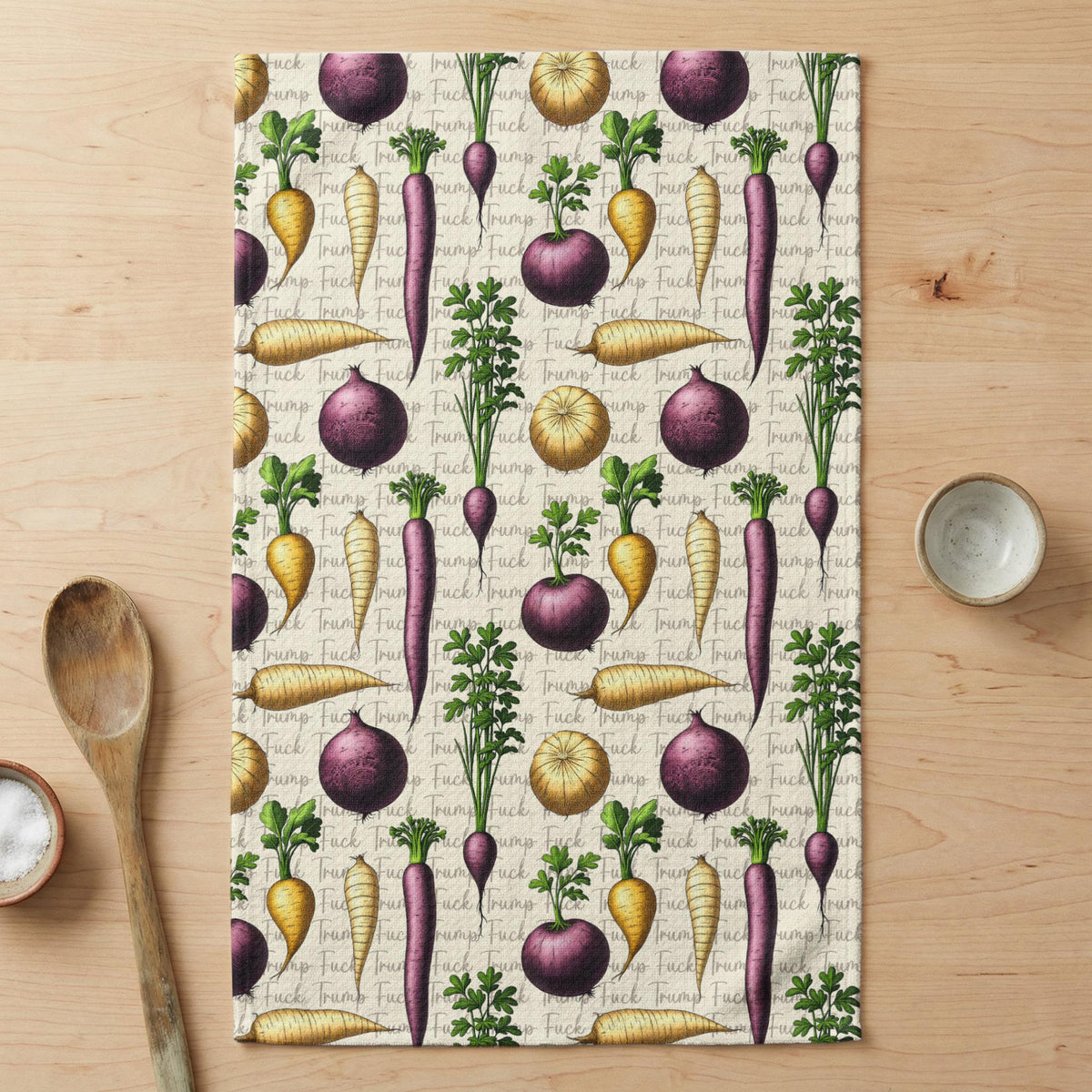 Towel with pattern of beets and onions interspersed with &amp;quot;Trump&amp;quot; text.
