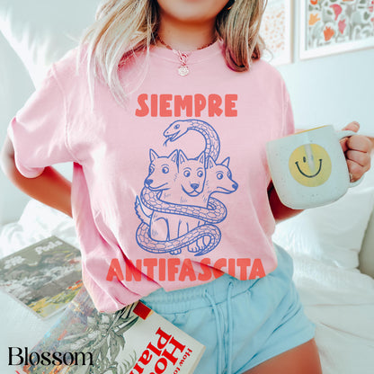 Pink t-shirt with &amp;quot;SIEMPRE ANTIFASCISTA&amp;quot; and three-headed dog design.