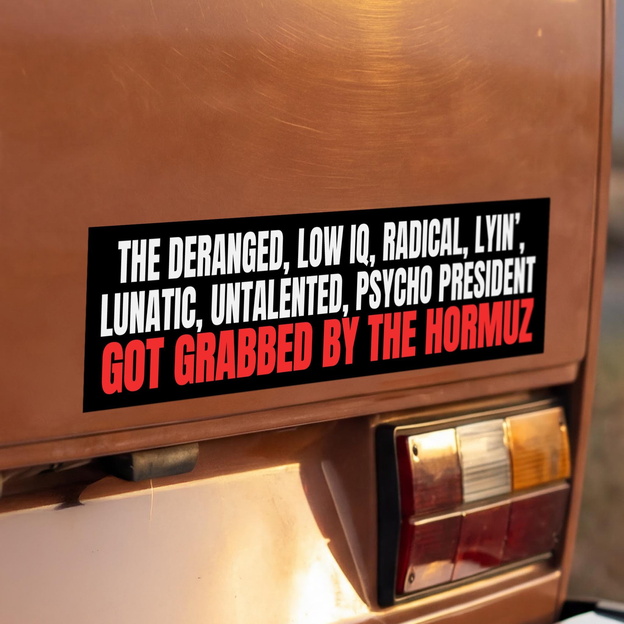 Bumper sticker with text about a president and the Hormuz.