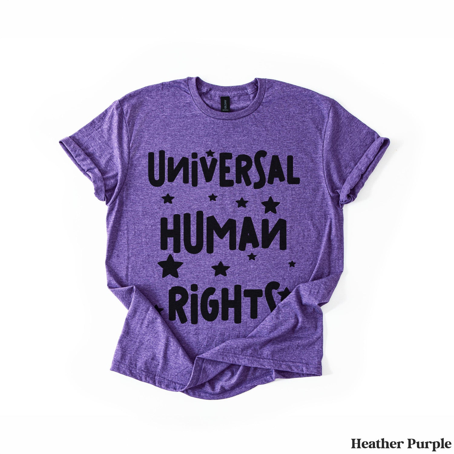 Purple t-shirt with &amp;quot;Universal Human Rights&amp;quot; and stars in black lettering.