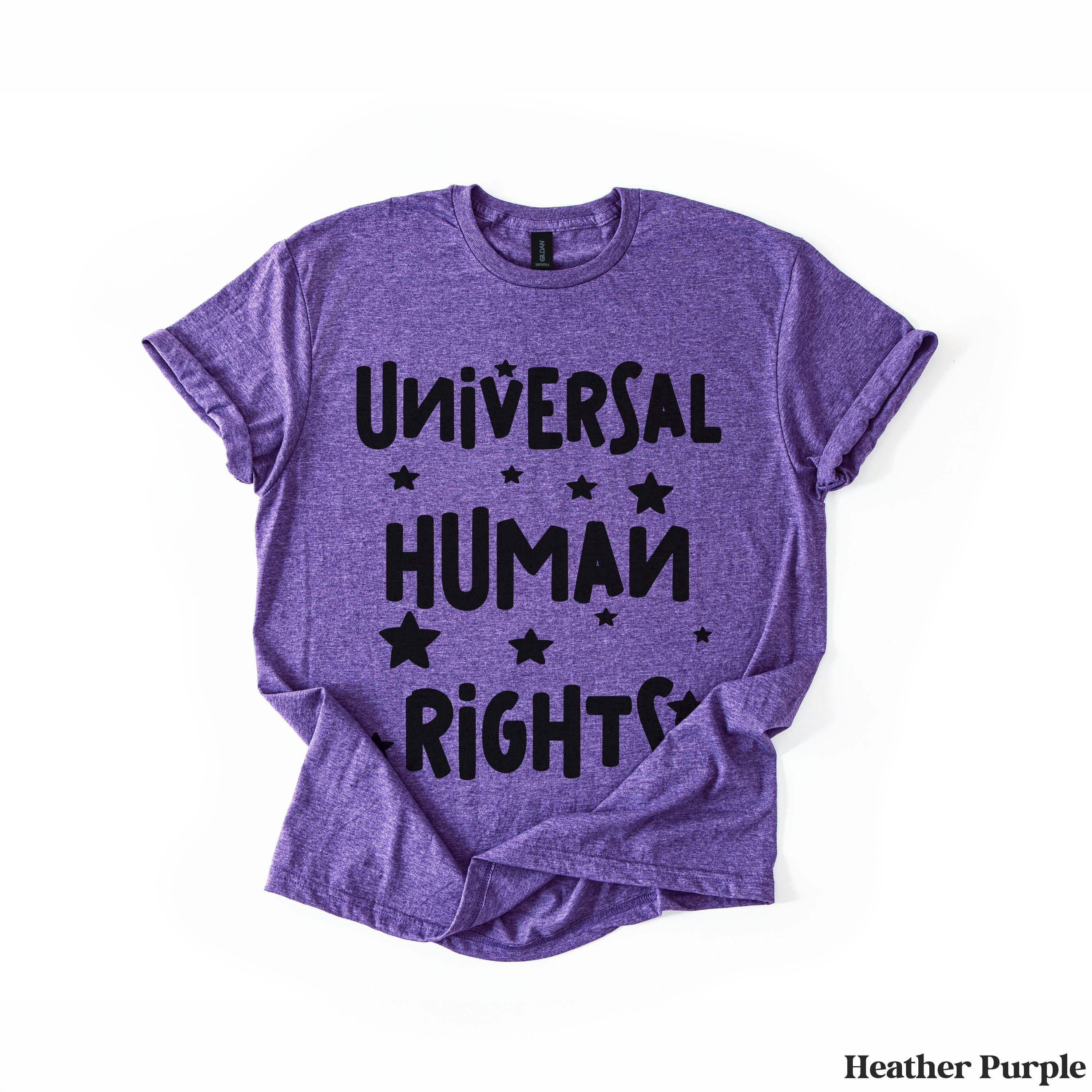 Purple t-shirt with &amp;quot;Universal Human Rights&amp;quot; and stars in black lettering.